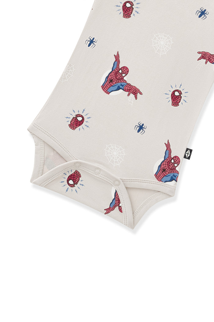 Snap buttons closure on Oat Bodysuit with Spider-Man print on a white background