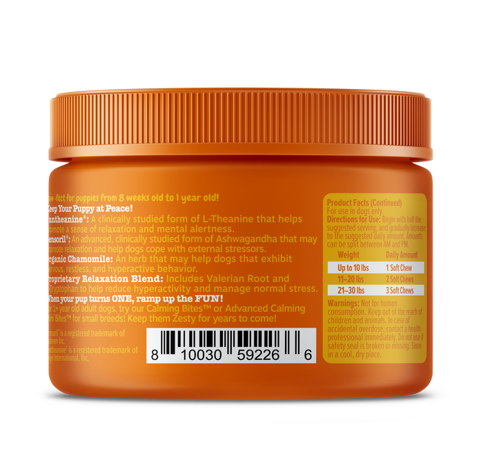 Orange jar with ridged cap containing puppy supplement bites, labeled with product information and barcode.