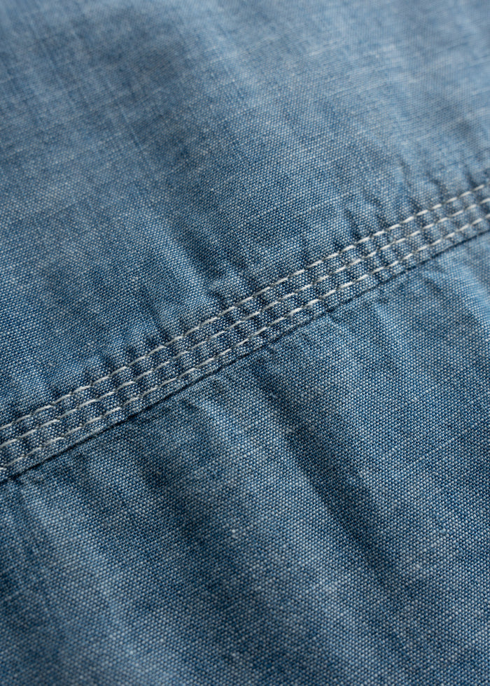 Close up of triple needle stitching on shoulder and side seams, showcasing reinforced construction