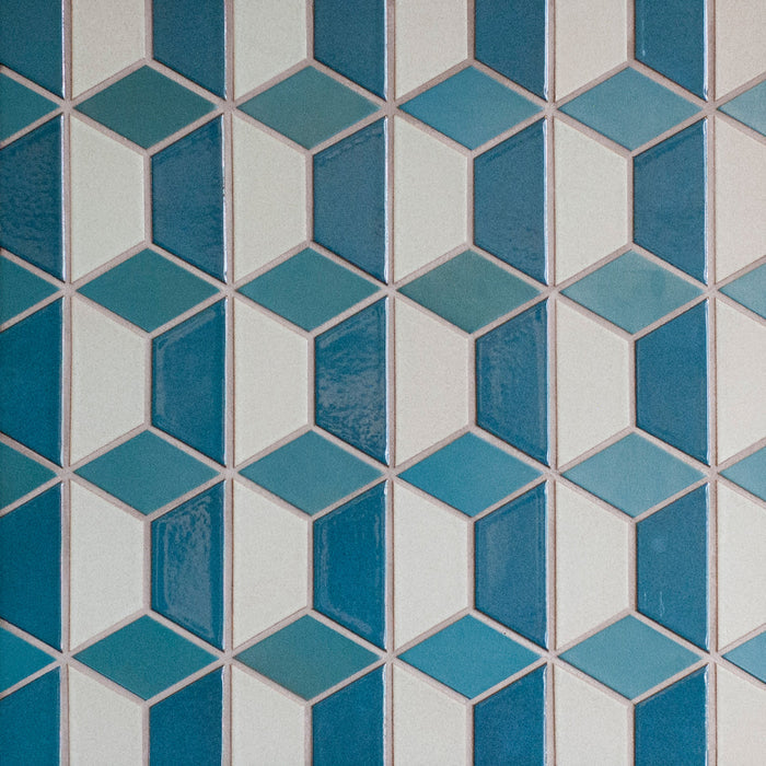 Caption: Classic Field Half Hex in G21 Opal Pacific & M63 Fog and Little Diamond in M40 Turquoise. Winter Grey grout by Custom Building Products.