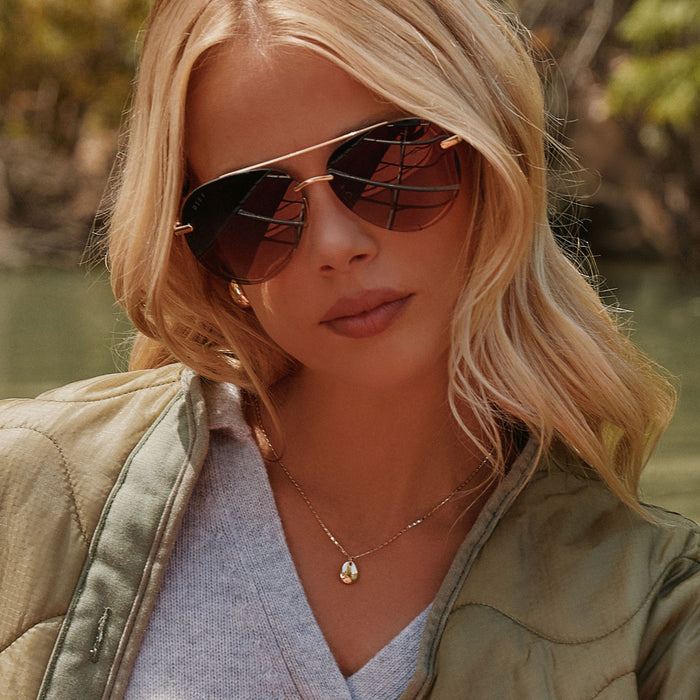 UGC - on model - female wearing lenox gold and black and grey gradient polarized front
