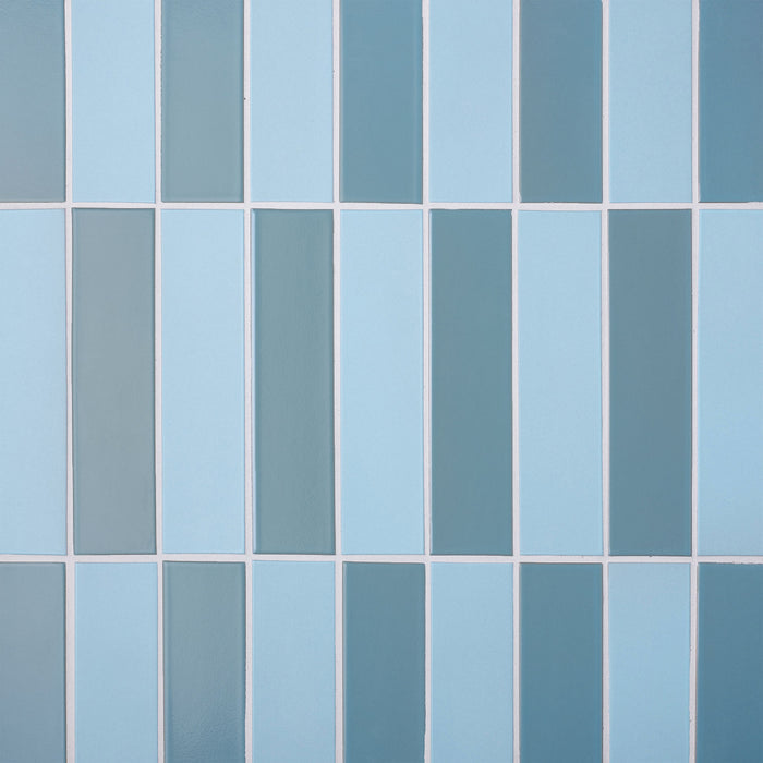 Caption: Classic Field 2x8 in G117 Wave Gloss & M67 Horizon Blue. Prism Cape Grey grout by Custom Building Products.