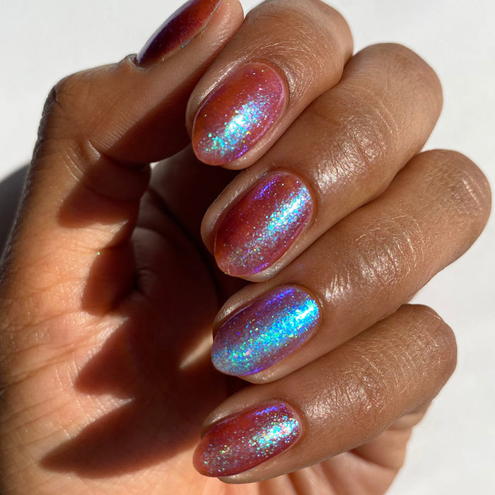 Close-up of nails painted with Smedge Haze Nail Lacquer on medium skin tone