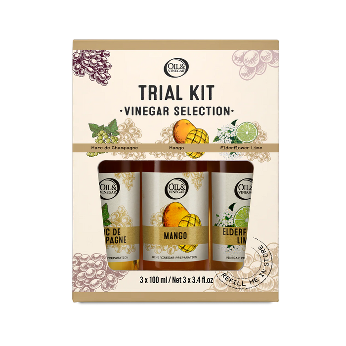 A pack of three 100ml vinegars from the Oil&Vinegar collection, including flavors marc de champagne, mango, and elderflower lime. The packaging is labeled 'TRIAL KIT - VINEGAR SELECTION' with an image of each vinegar variety.