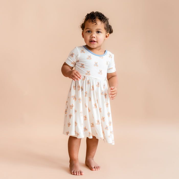 Little girl wearing Twirl Dress in Teddy Bear