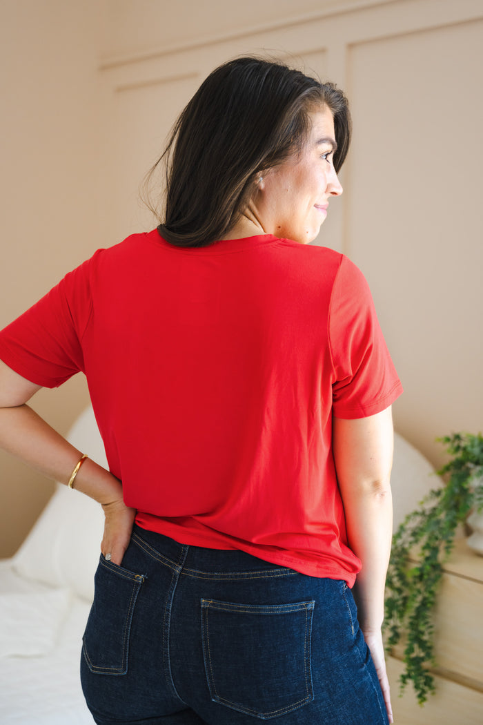Back side of Women's Crew Neck Tee in Cardinal over navy denim