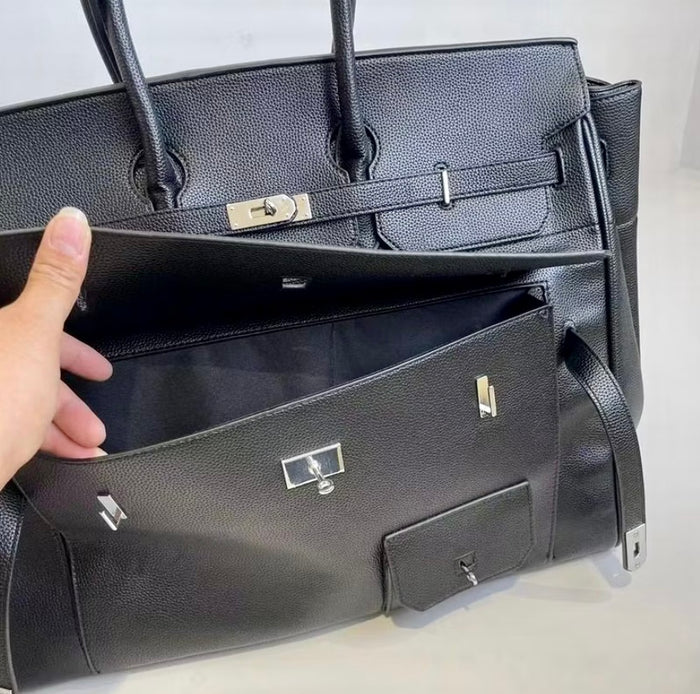 Black leather men's multipocket travel bag tote with multiple compartments by Travellers Hat Boutique