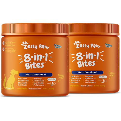 Two orange jars of Zesty Paw 8-in-1 multivitamin bites for dogs with white text and yellow dog illustration on label.