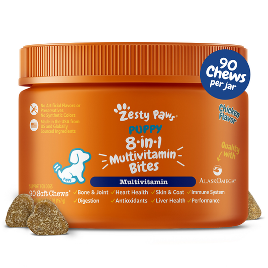 Orange jar of Zesty Paw puppy multivitamin bites with blue label and two soft chew samples in front.