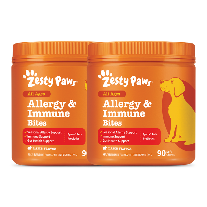 Two orange Zesty Paws Allergy & Immune Bites containers with lamb flavor and yellow dog illustration on right jar.