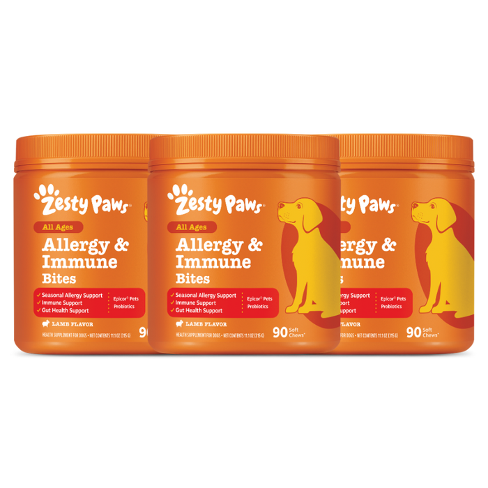 Three orange jars of Zesty Paw Allergy & Immune Bites with yellow dog silhouettes and lamb flavor labels.