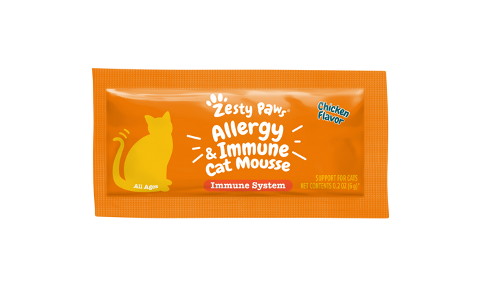 Orange packet of Zesty Paw Allergy & Immune Cat Mousse in chicken flavor with yellow cat silhouette.
