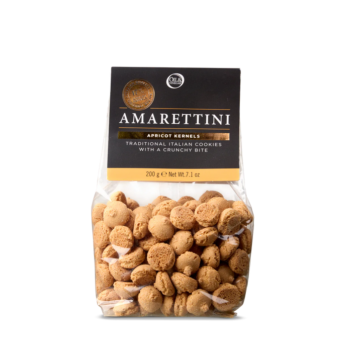 Packaging of Amarettini cookies displaying the product name and a transparent window showing the small, round, beige cookies inside.