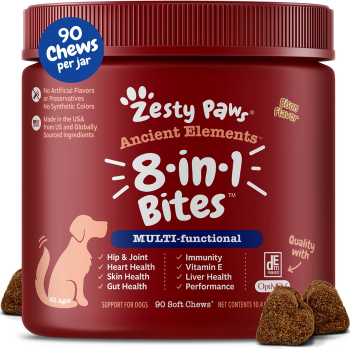 Burgundy jar of Zesty Paw Ancient Elements 8-in-1 dog chews with brown soft chew bites displayed in front.