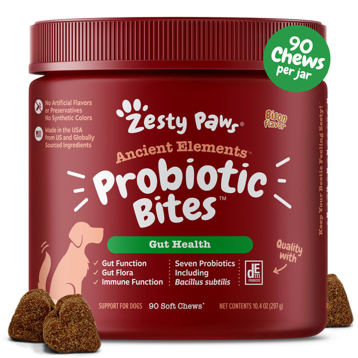 Dark red jar of Zesty Paw's Ancient Elements Probiotic Bites for dogs with green label and brown soft chew samples displayed.