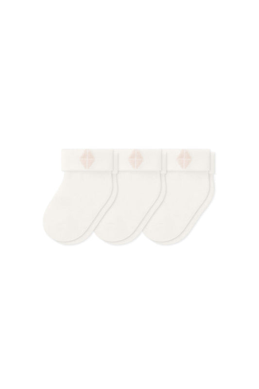 Three socks in Cloud laying flat on a white background.