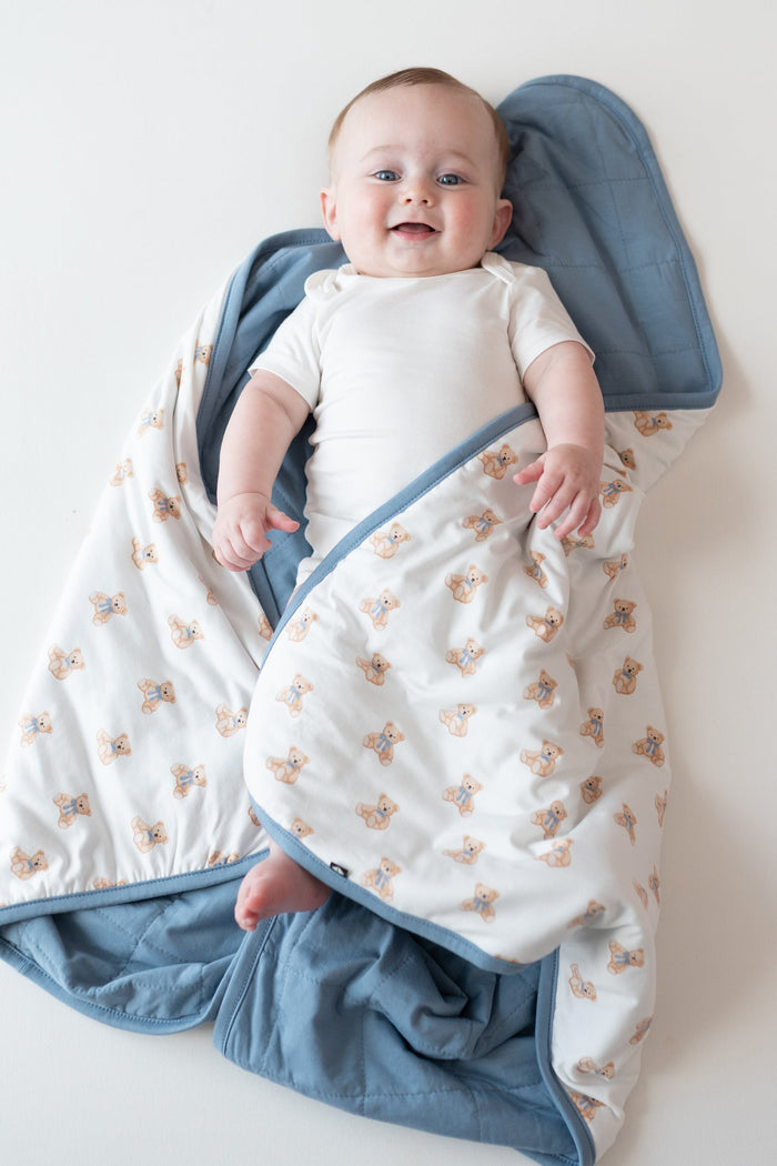 Baby laying on Baby Blanket in Teddy Bear 1.0