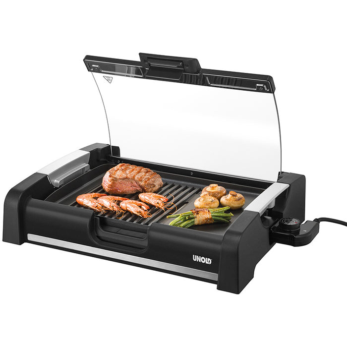 Der Unold Barbecue-Grill Edel, ein schwarzer Elektrogrill mit silbernen Akzenten und einem seitlichen Temperaturregler, verfügt über einen Glasdeckel und präsentiert gegrilltes Hähnchen, Garnelen, Pilze und grüne Bohnen auf seiner Grillfläche.