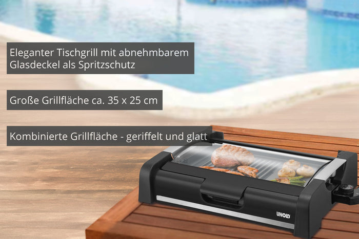 Der Unold Barbecue-Grill Edel, ein schwarzer Tischgrill mit Glasdeckel, steht auf einem Holztisch am Pool und grillt Fleisch und Gemüse. Deutscher Text stellt seine Funktionen und Grillfläche vor.