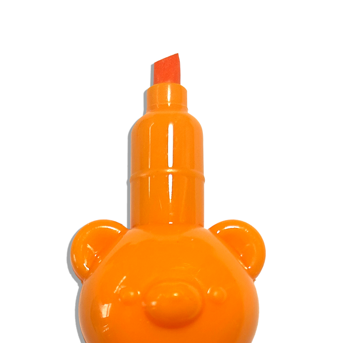 Close up of orange OOLY Bear Besties Stacking Highlighters showing chisel tip on a white background