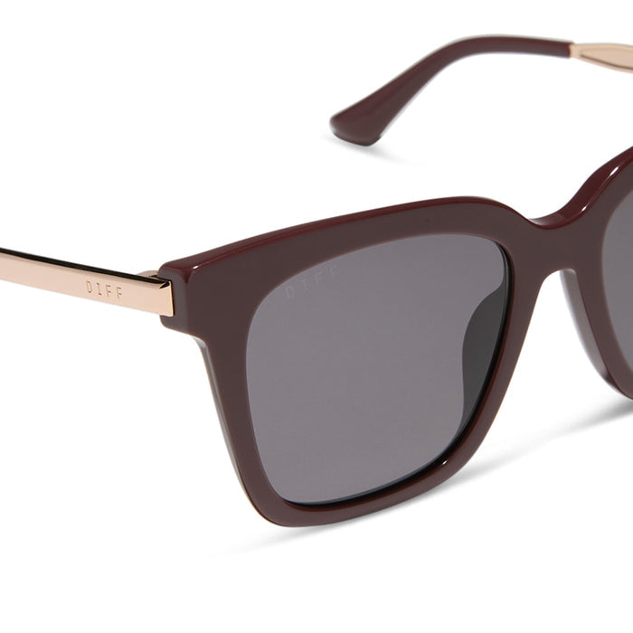 diff eyewear bella oversized square sunglasses with a rugby red acetate and gold metal frame with grey lenses detailed view