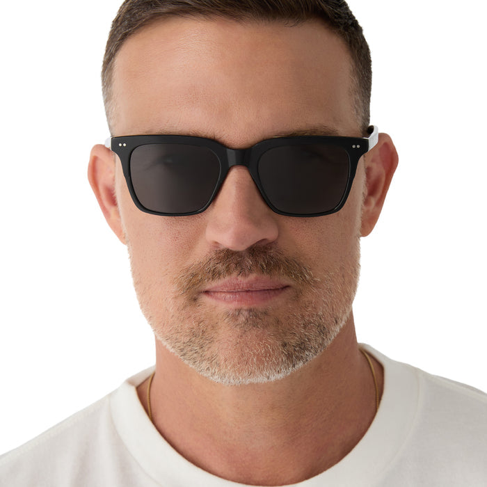 on model - male wearing Billie sunglasses with black frame and grey polarized lens-front view
