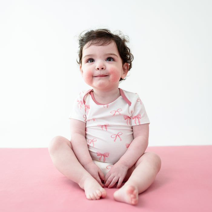 Young toddler wearing Bodysuit in Bow