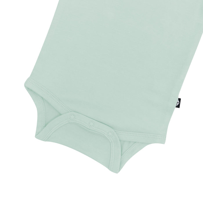 Close up of the snaps on the Kyte Baby Bodysuit in Sage