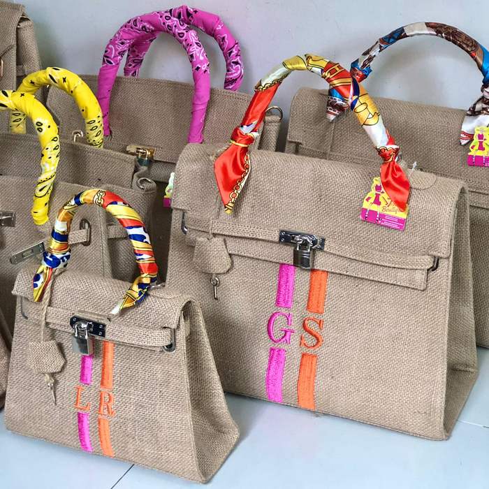 Burlap O'Kelly handbag collection by Travellers Hat Boutique with colorful scarf-wrapped handles and embroidered stripes