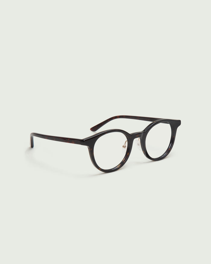 Dark Tort::Caine Eyeglasses round tort acetate front diagonal