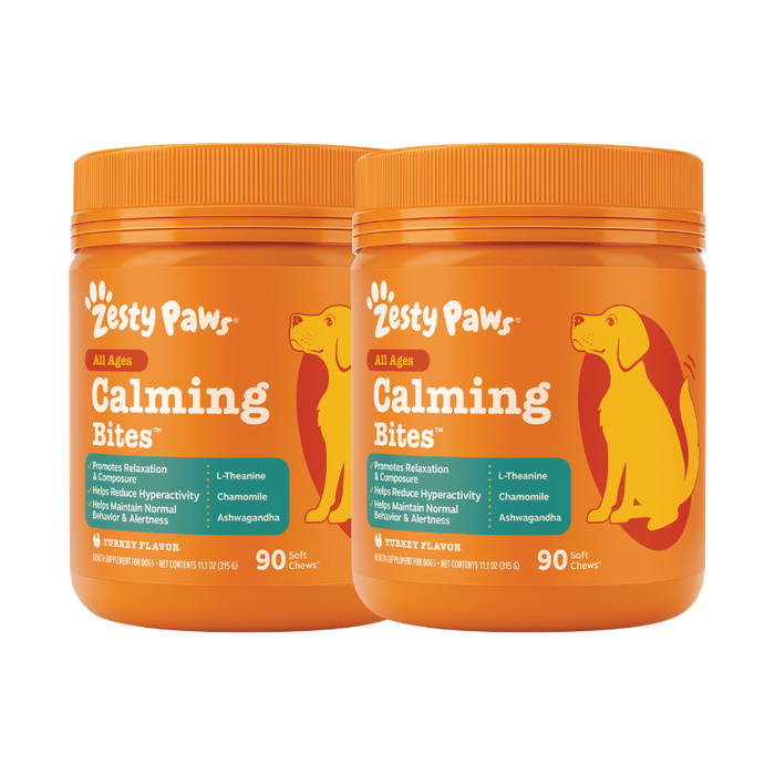 Two orange Zesty Paws Calming Bites bottles with dog silhouettes, containing 90 soft chews each in turkey flavor.
