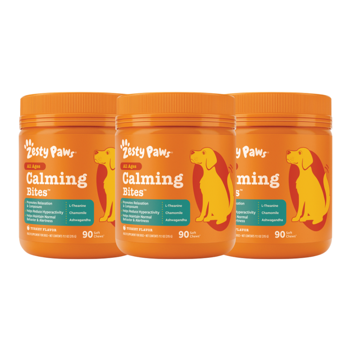 Three orange Zesty Paws Calming Bites containers with yellow dog silhouettes and teal labels, each containing 90 chews.