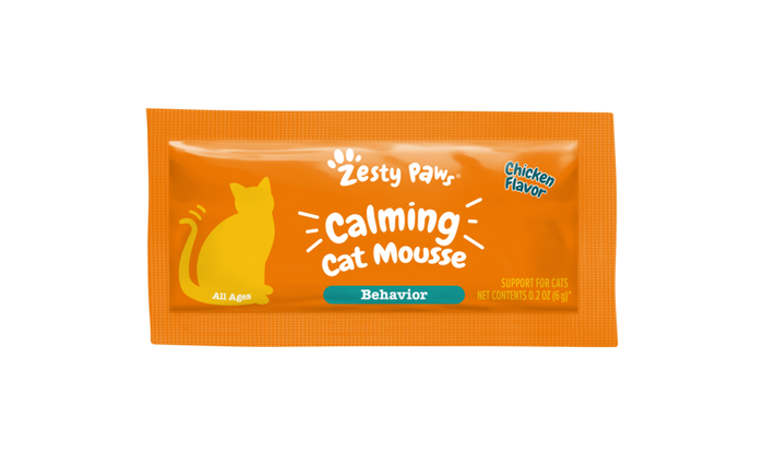 Orange packet of Zesty Paw Calming Cat Mousse with yellow cat silhouette and chicken flavor label.