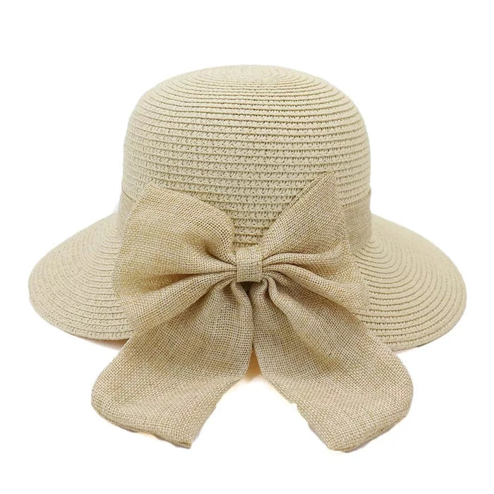 Personalized straw hat for women with wide brim and large decorative bow in natural beige color