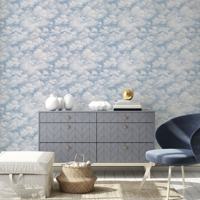 Tempaper's Clouds Peel And Stick Wallpaper in light blue shown behind a dresser.