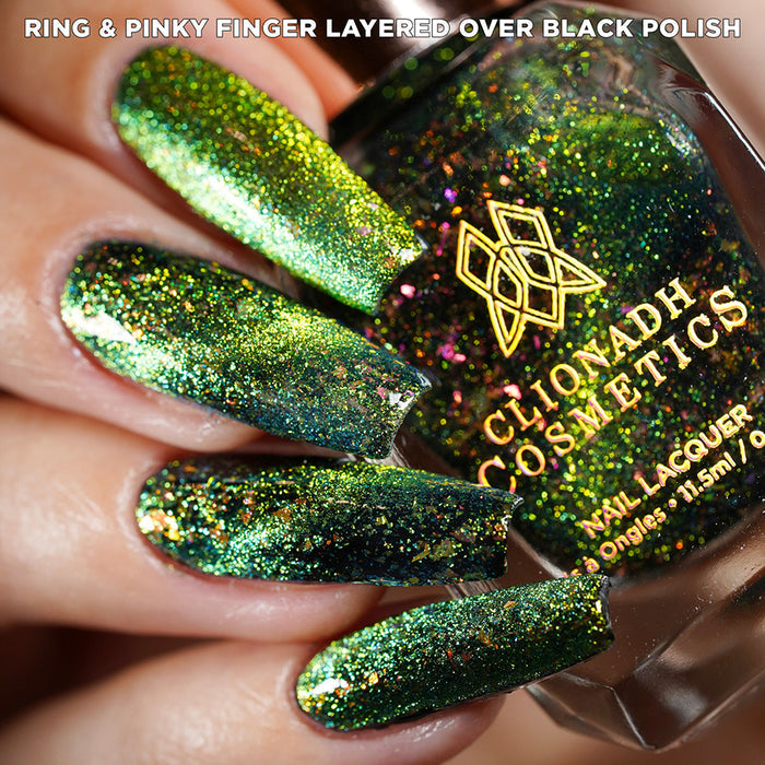 Close-up of nails painted with Conocybe Nail Lacquer on fair skin tone. Hand is holding polish bottle.