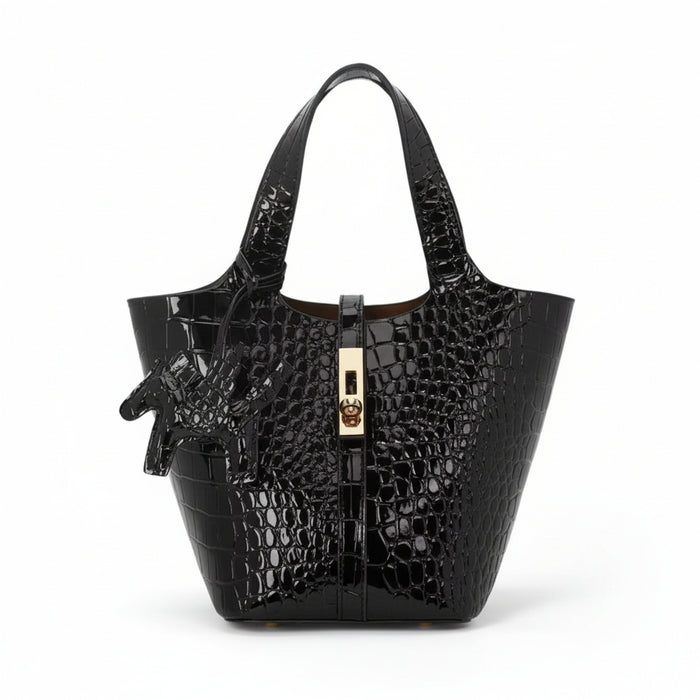 Black crocodile-embossed handbag with gold zipper on a white background