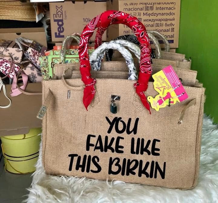 35cm printed burlap bag with red bandana handle cover and black bold text You Fake Like This Birkin