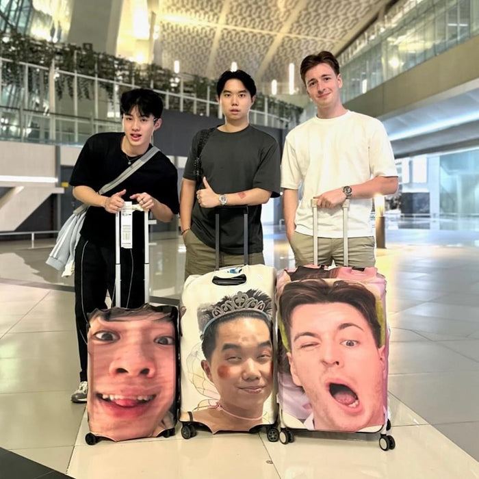 Travel luggage cover with name featuring custom face prints on three suitcases carried by travelers