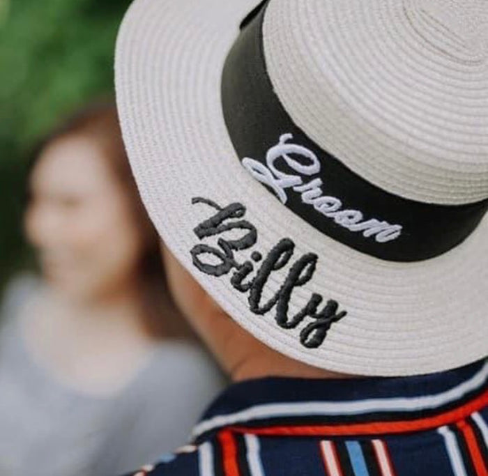 Custom prenuptial hat set featuring a groom hat with personalized name embroidery from Travellers Hat Boutique