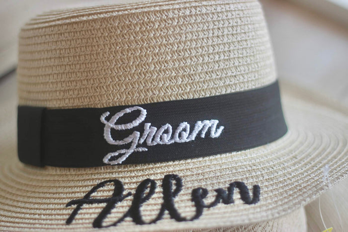 Custom prenuptial hat set featuring a beige woven hat with black band embroidered with Groom and Allen