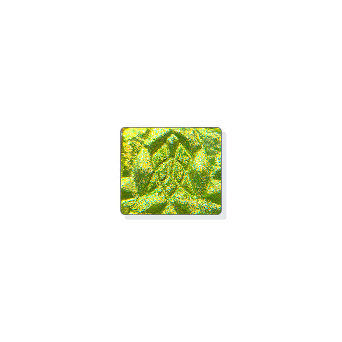 A single multichrome eyeshadow in colour Dias on a white background.  A chartreuse base large particle glitter that shifts peach-lime-aqua.