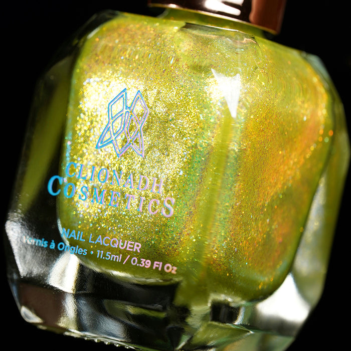 Angled, close-up of Dais Nail Lacquer bottle on a black background.