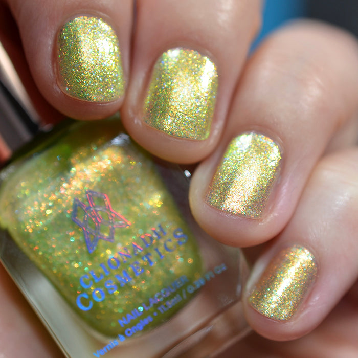 Close-up of nails painted with Dais Nail Lacquer on fair skin tone. Hand is holding polish bottle.