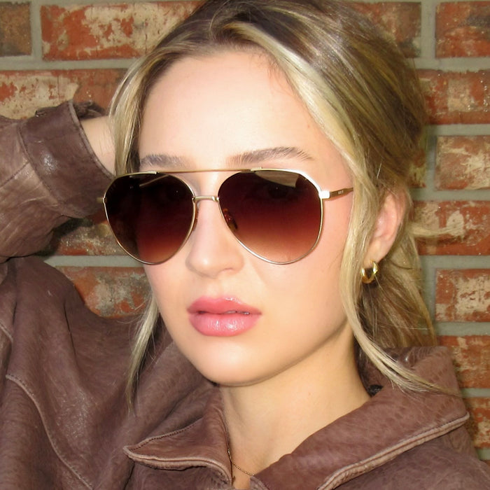on model - female wearing Dash Brushed Gold Coffee Gradient Sunglasses front