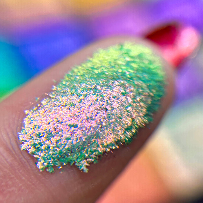 Macro finger swatch of Duke Glitter Vibrant Multichrome Eyeshadow.