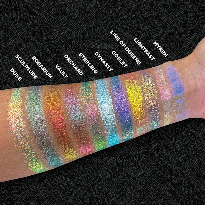 Top angled arm swatches of Duke and the rest of the Holiday Expansion Bundle shades on medium skin tone.