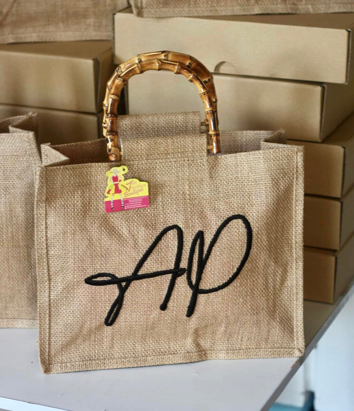 Personalized eco friendly tote bag with bamboo handles by Travellers Hat Boutique in natural jute fabric