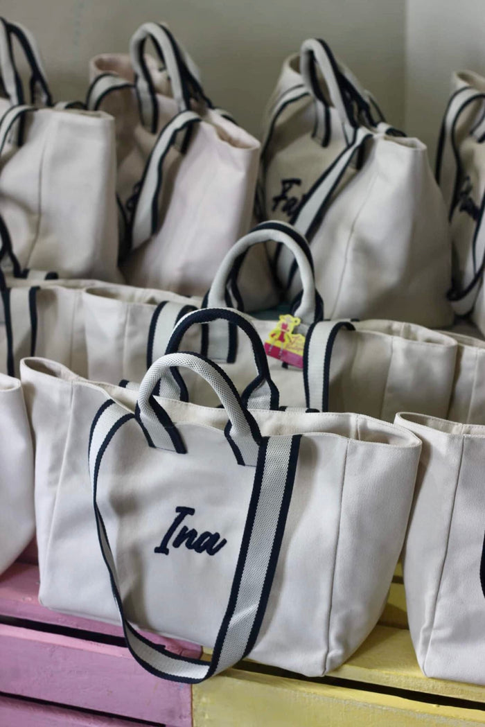 Embroidered boat tote bag with navy handles and personalized name embroidery by Travellers Hat Boutique