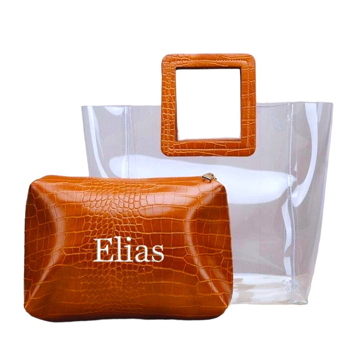 Embroidered clear tote bag with brown faux crocodile handle and matching pouch from Travellers Hat Boutique
